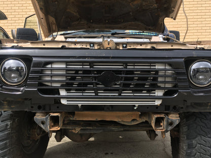 PDI front mount intercooler fitted behind the grille of a Nissan GQ Patrol